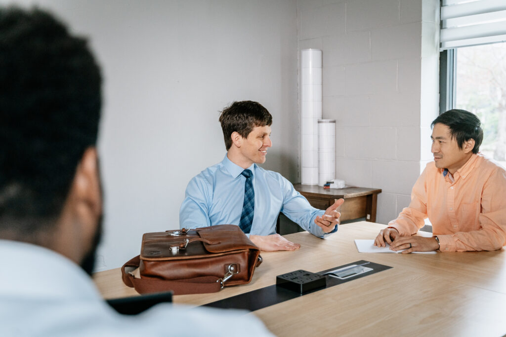 Trevor mediating an issue between two clients.